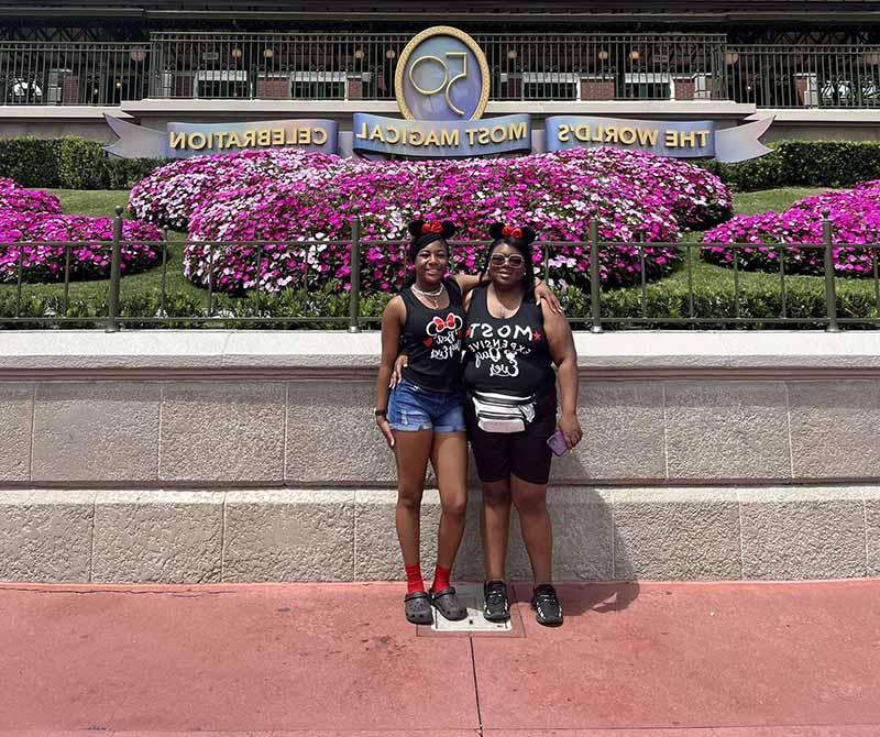 Fatima Mathews (left) with her daughter, Londyn, on their Disneyland trip. Fatima tucks her LVAD equipment into a fanny pack and works the ensemble into her outfits. (Photo courtesy of Fatima Mathews)